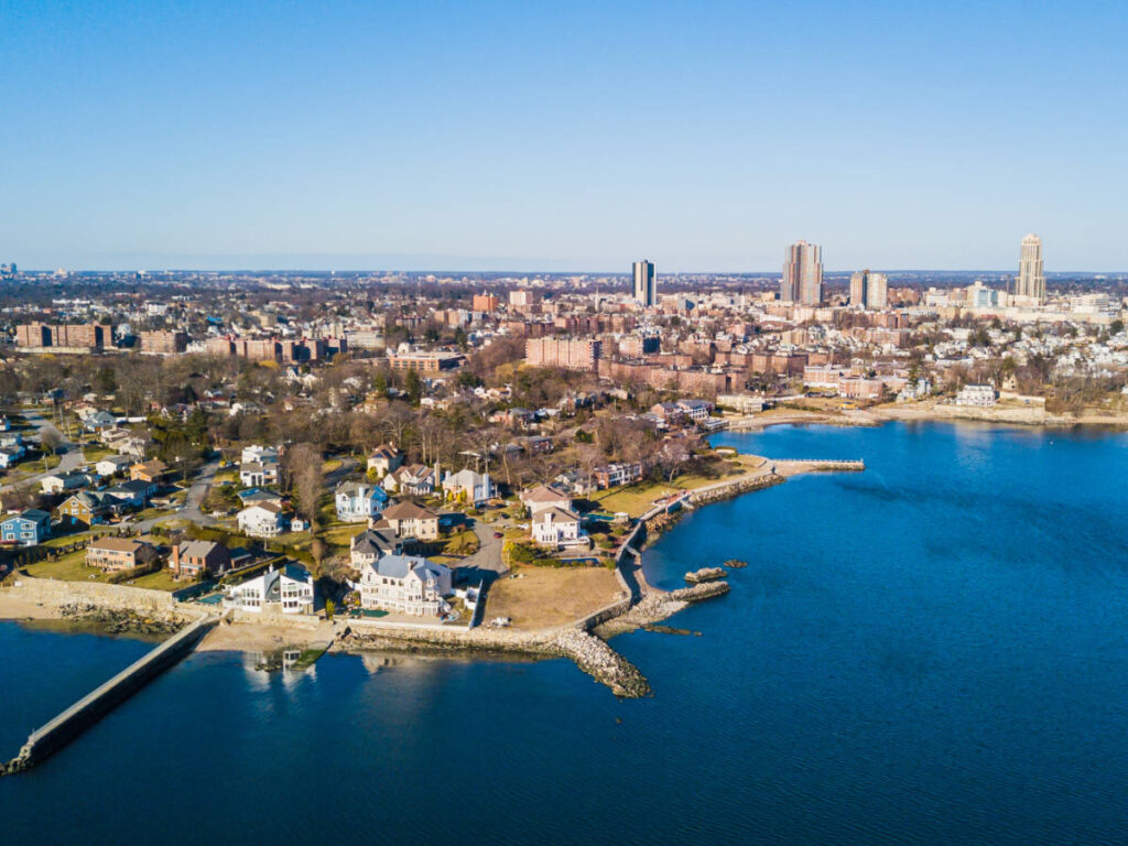 Aerial view of blue water and houses in New Rochelle