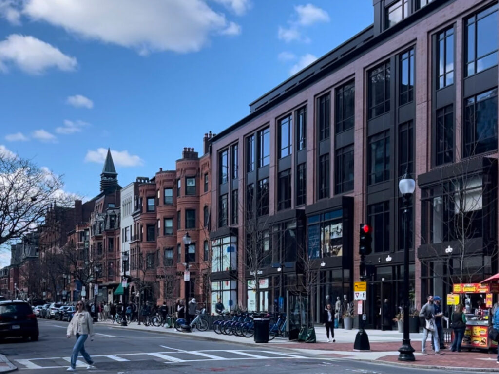 A person walking on the pedestrian at Newbury Street in Back Bay, Boston