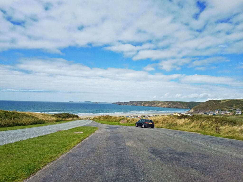 A lone car at the side of the street near the Newgale beach