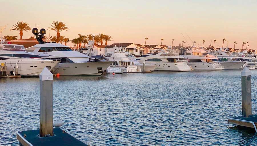 Boats and yachts at the Newport Harbor during sunset