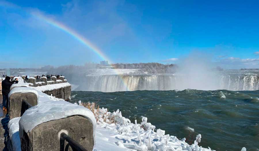 A rainbow end at the Niagara Falls during winter season