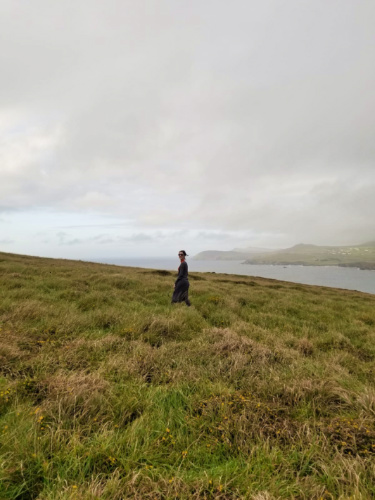 The author Niamh Hayes walking on top of the mountain