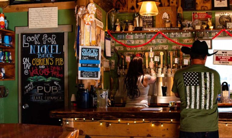 A man ordering his beer in Nickle Beer Company