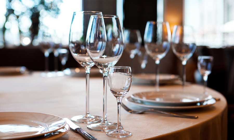 Empty wine glasses on a table in Nick’s Laguna Beach