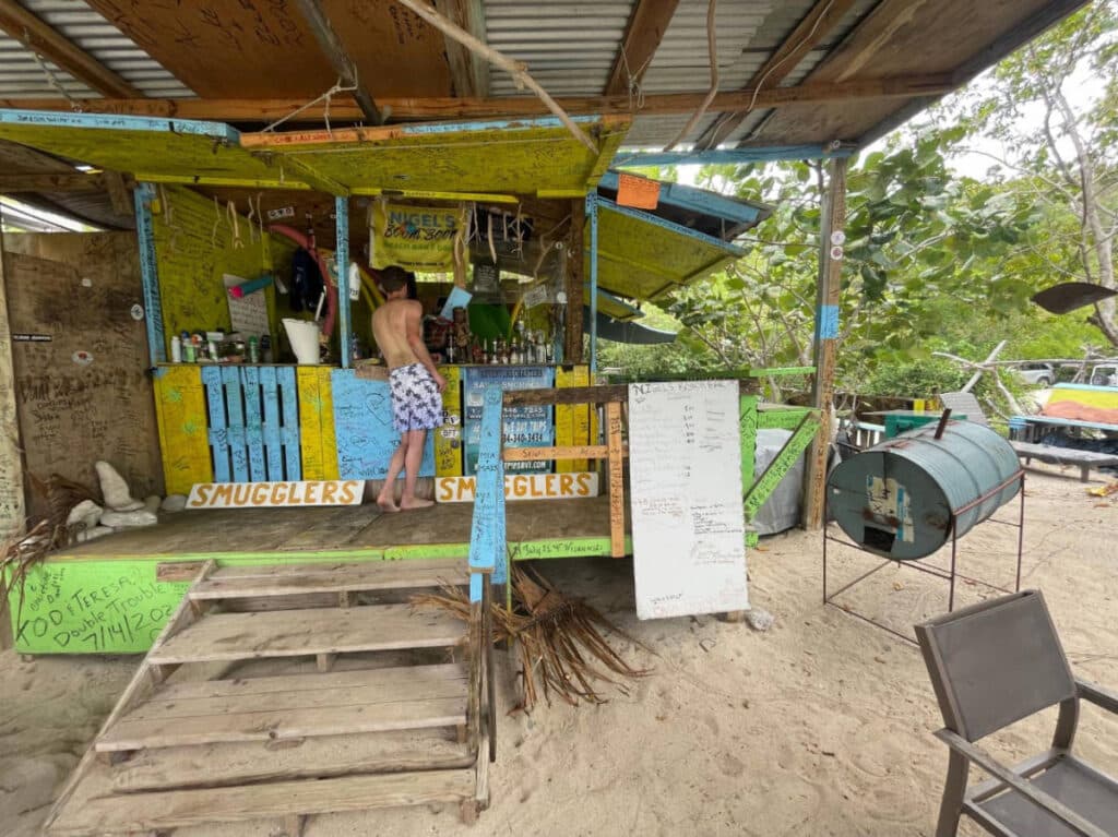 A man buying a drink at the Nigel’s Beach Bar