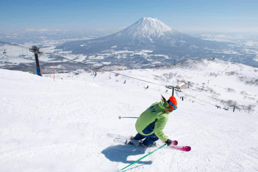 A skier on the cliff with the Mt. Fuji in the background