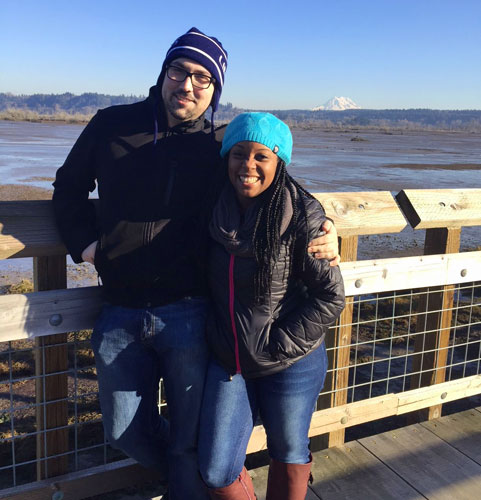 View of the author and her husband with the mount rainier from afar