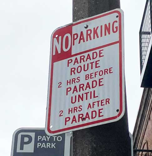 A no parking sign on a post