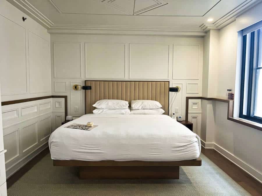 View of the bed inside the hotel room in Noelle