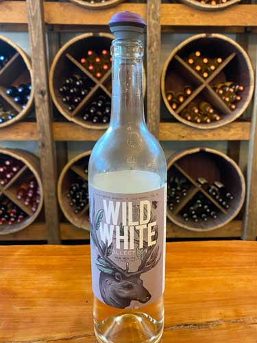 An empty bottle of wine during a wine tasting at the Noisy Water Winery