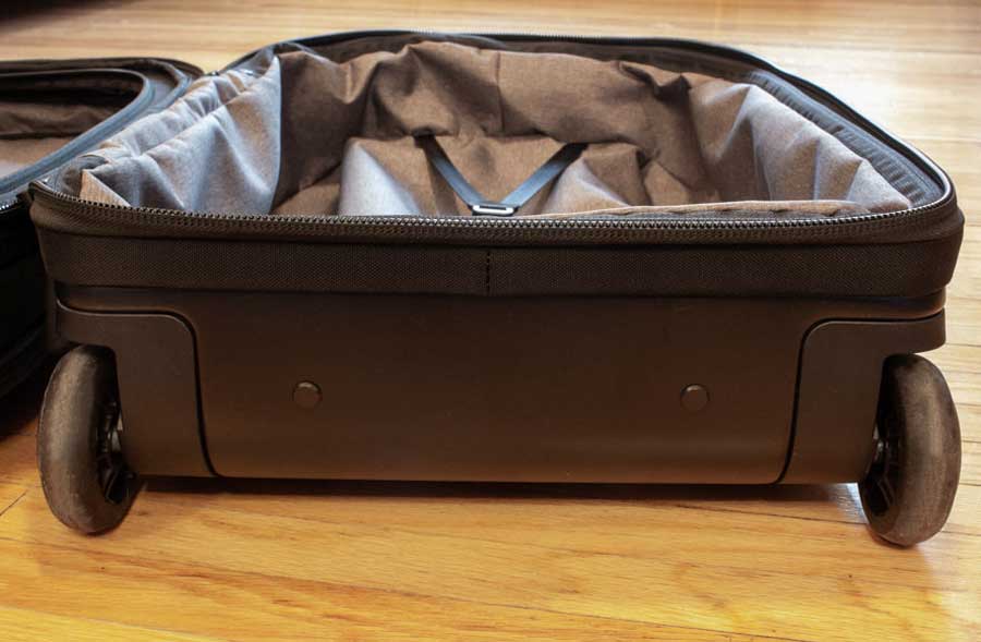 View of the double roller wheels of the Nomatic Navigator Carry On