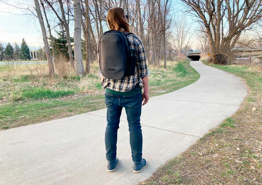 The author's husband wearing a Nomatic Navigator Lite Backpack
