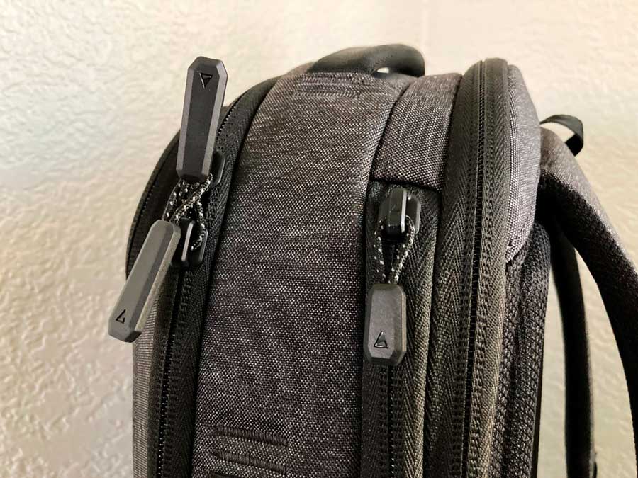 Close up view of the zippers in Nomatic Navigator Lite Backpack