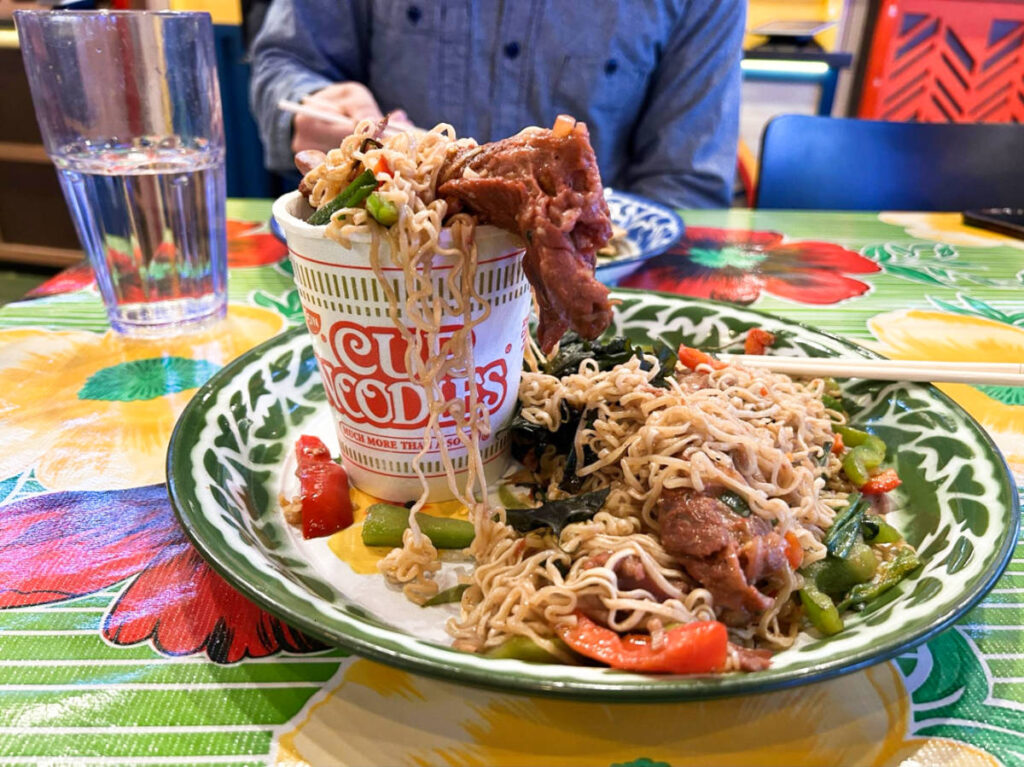 A plate of noodles dish served with the famous Nissin Cup Noodles at the Asean Streat Food Hall