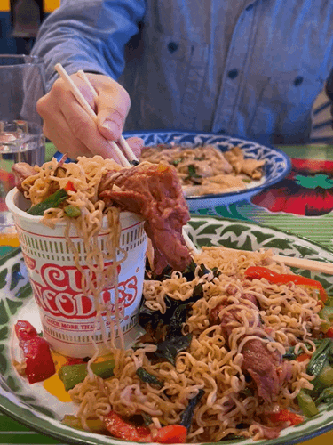 The author's husband picking the food from another plate