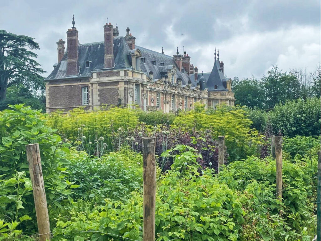 View of Normandy manor with a garden