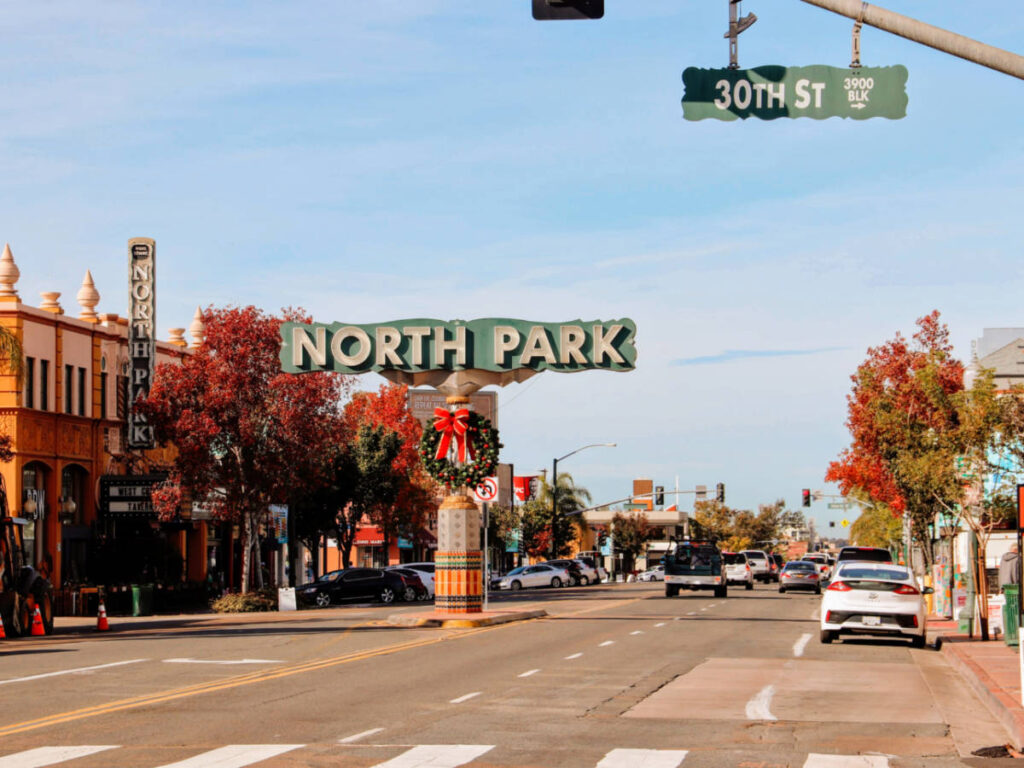 View of the North Park sign along the street in autumn