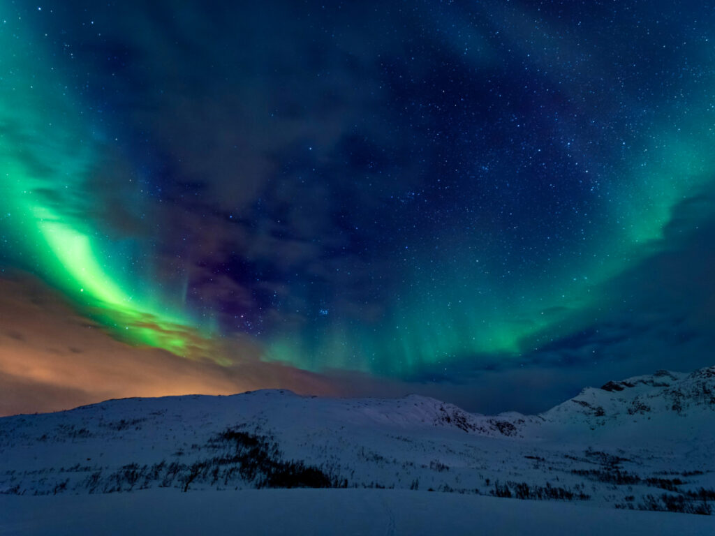 Scenic view of the northern lights over Tromso