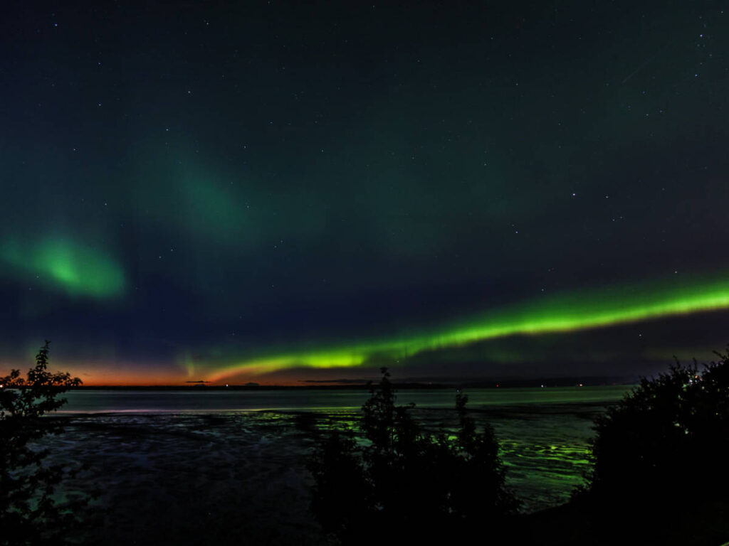 The colorful Northern Lights on the night sky in Cook Inlet