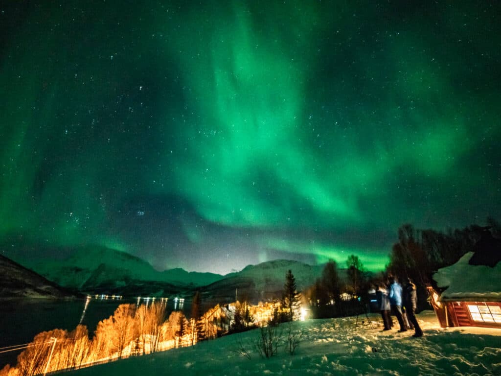 View of the majestic Northern Lights over the mountain town