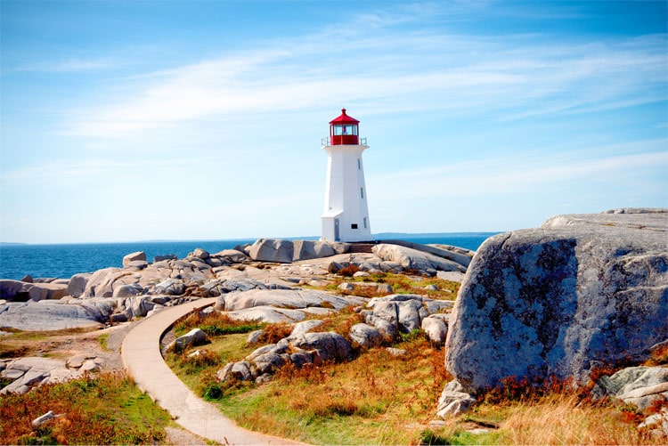 View of Peggys Cove Lighthouse on a rocky landscape