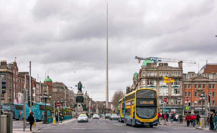 View of the spire of Dublin at the busy O'Connell Street on a gloomy day