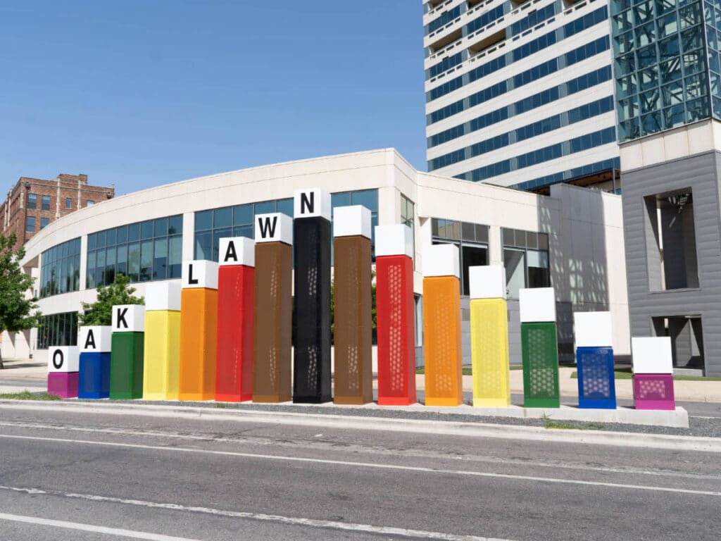 Oak Lawn signage in rainbow at the Cedar Springs strip