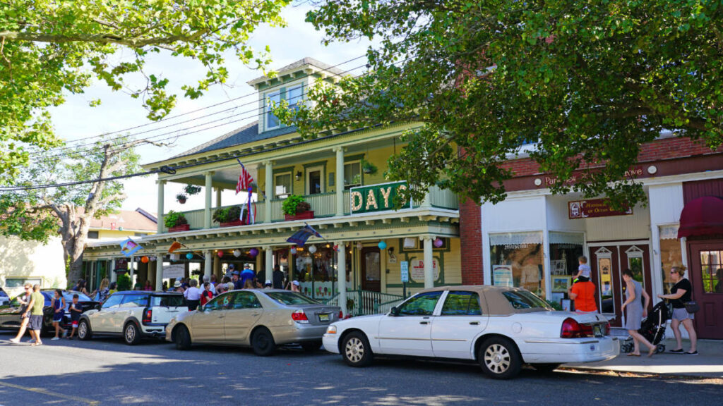 Cars parked on the side of the road in Ocean Grove town