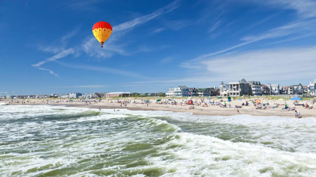 A colorful hot air balloon over the Ocean Grove Beach in New Jersey