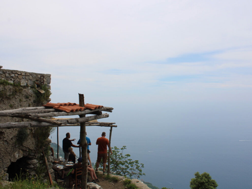 Group of people looking at the Ocean views on Path of the Gods Hike