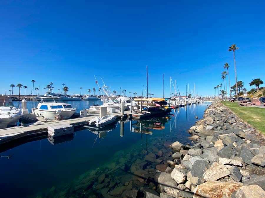 View of boats by the ocean in Oceanside Marina Suites