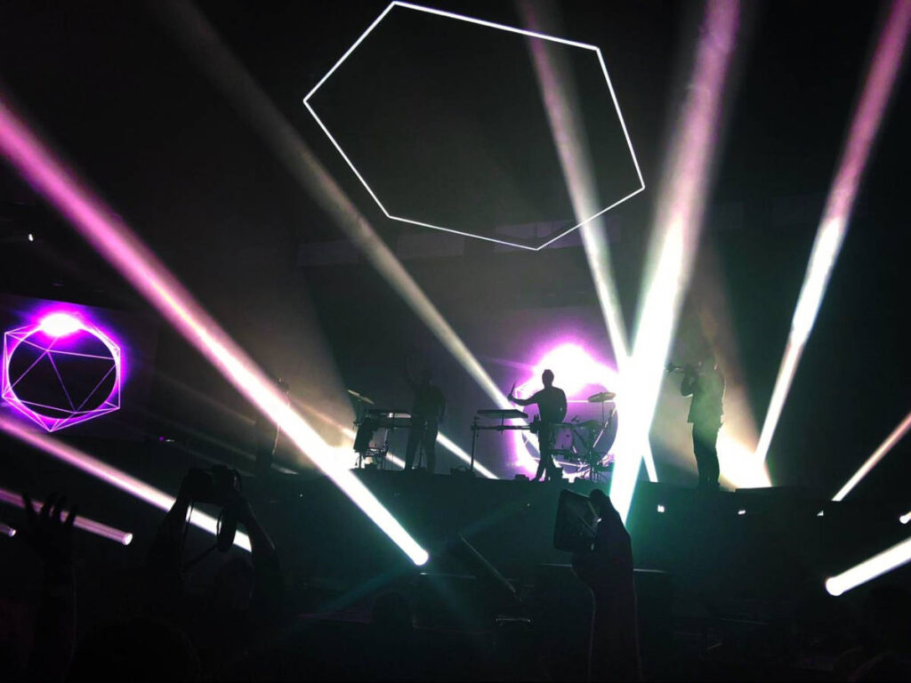 Dark stage with purple lights at the Odesza show