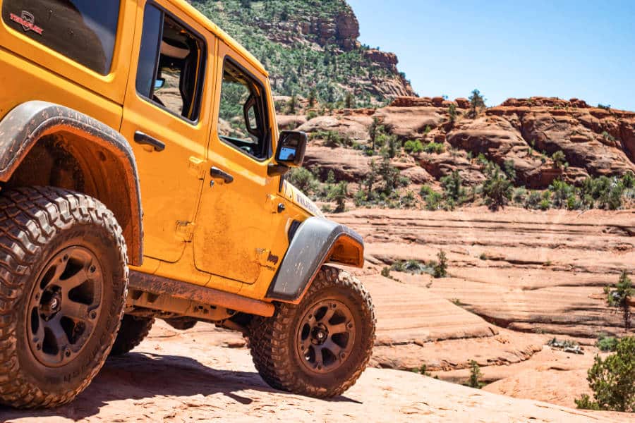 A yellow jeep on the desert landscape in Sedona, Arizona