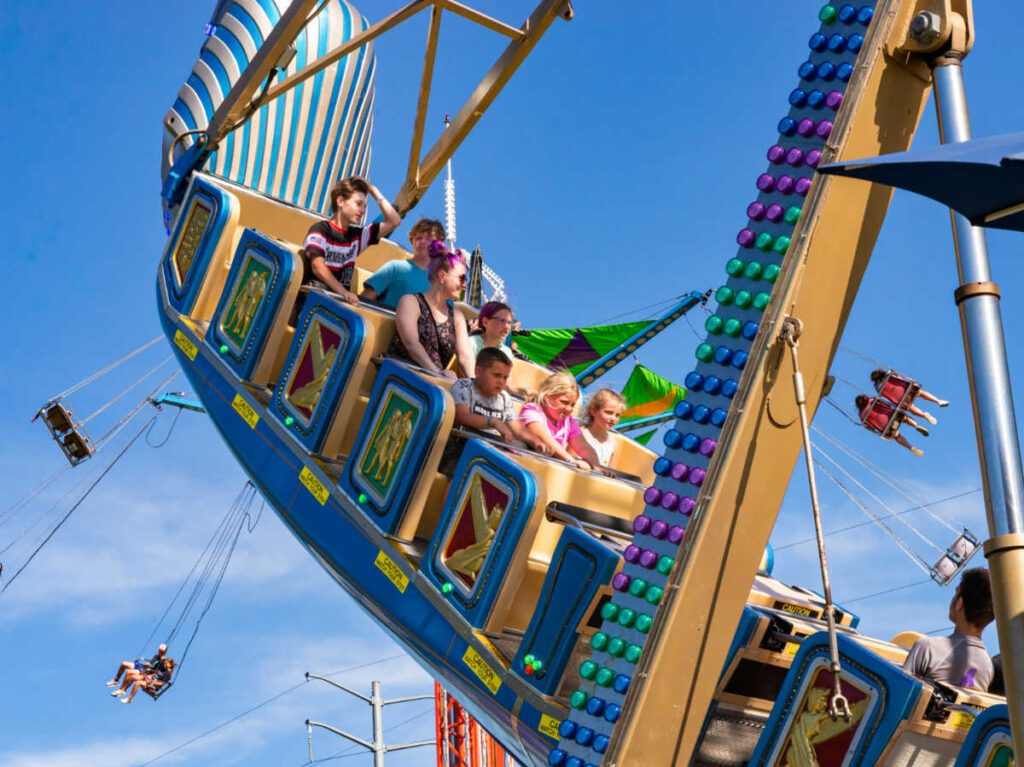 The people riding the carnival ride at the Oglesby Fun Fest