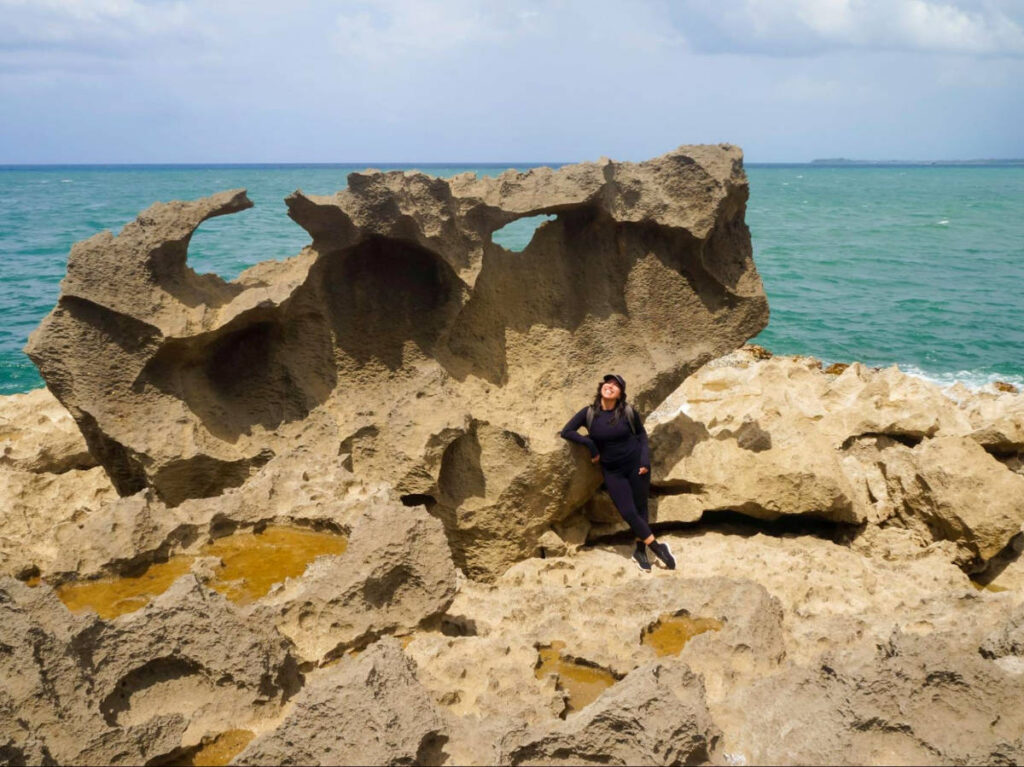 Travel Lemming author Vanessa posing for a photo near an ox-shaped rock at Ojo de Buey