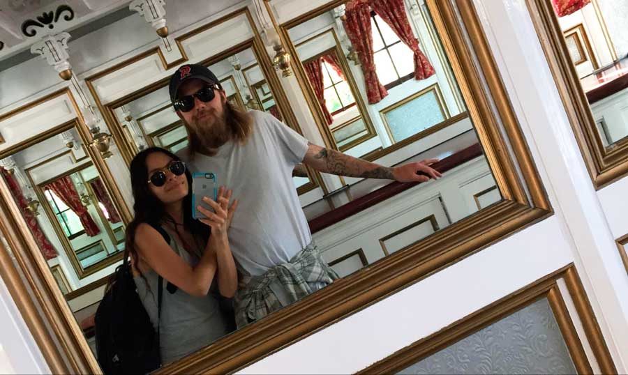 The author with her partner taking a mirror selfie on the old American-style steamboat