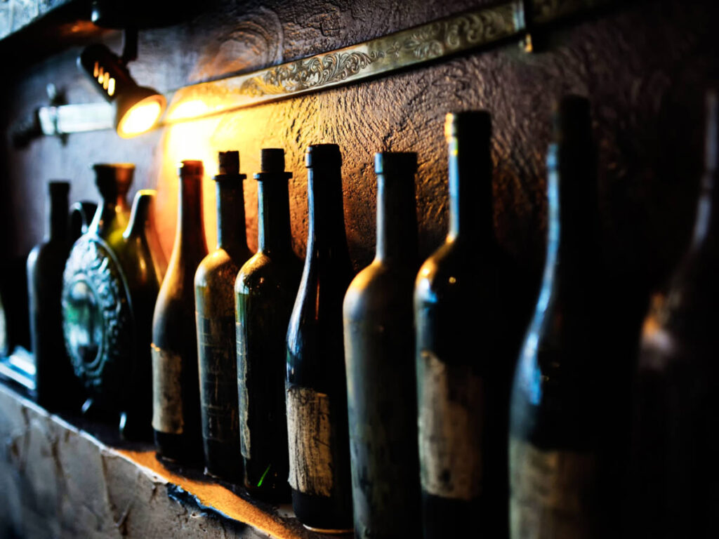 View of the lined old wine bottles at the wine cellar