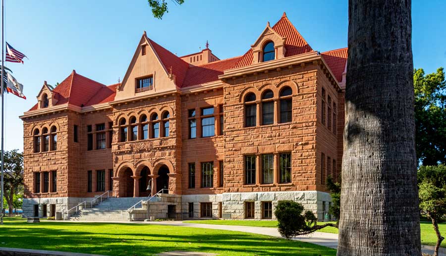 The Old Orange County Courthouse building from the outside under the clear blue sky