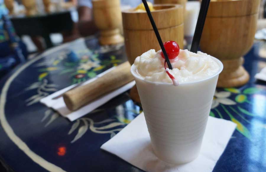 A milkshake with cherry on top and a straw from Old San Juan