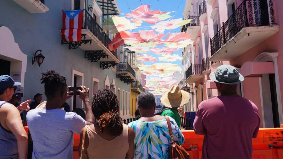 View of tourists under the clear blue sky at Old San Juan