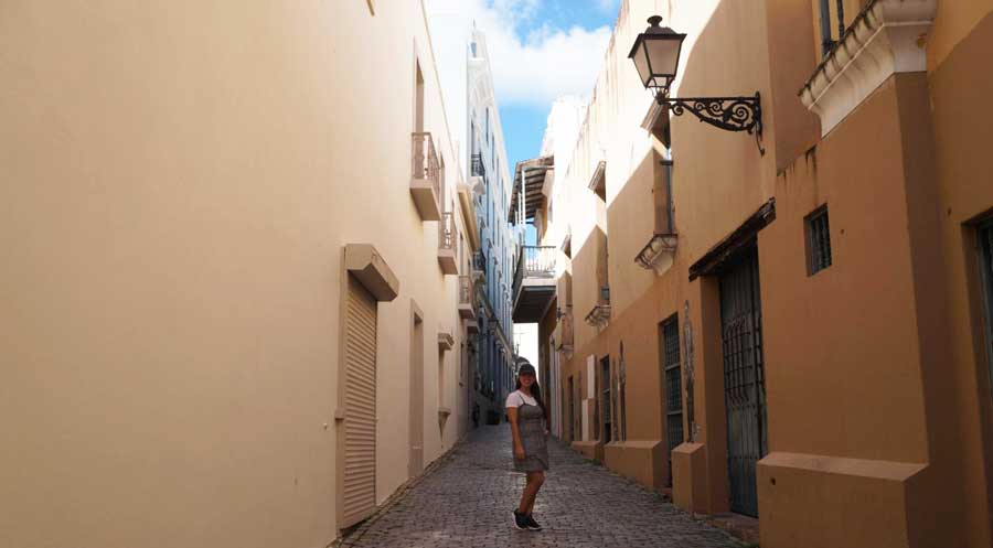 The author posing for a photo in a street in Old San Juan