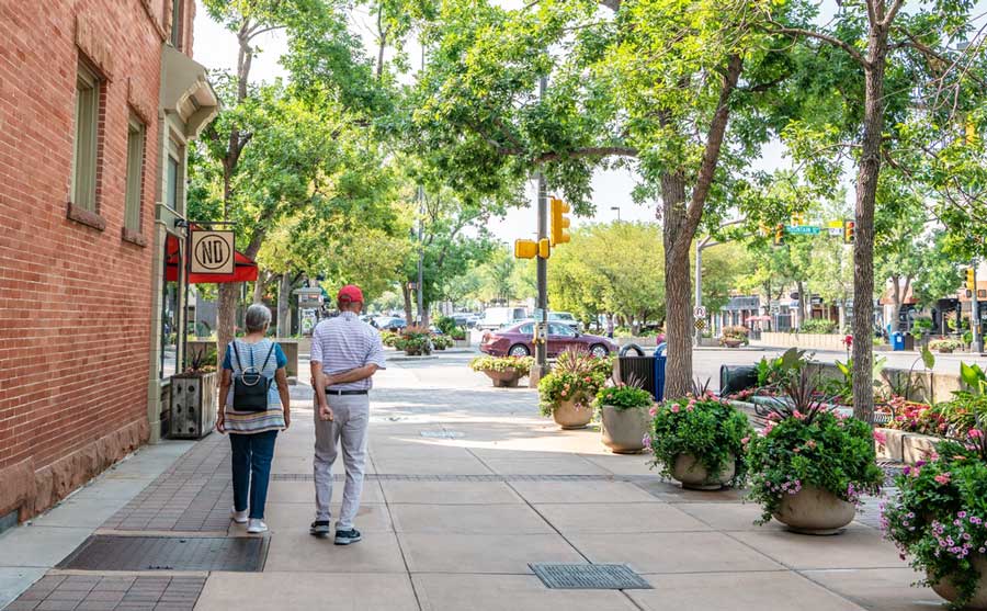 An old couple walking in Old Town Fort Collins