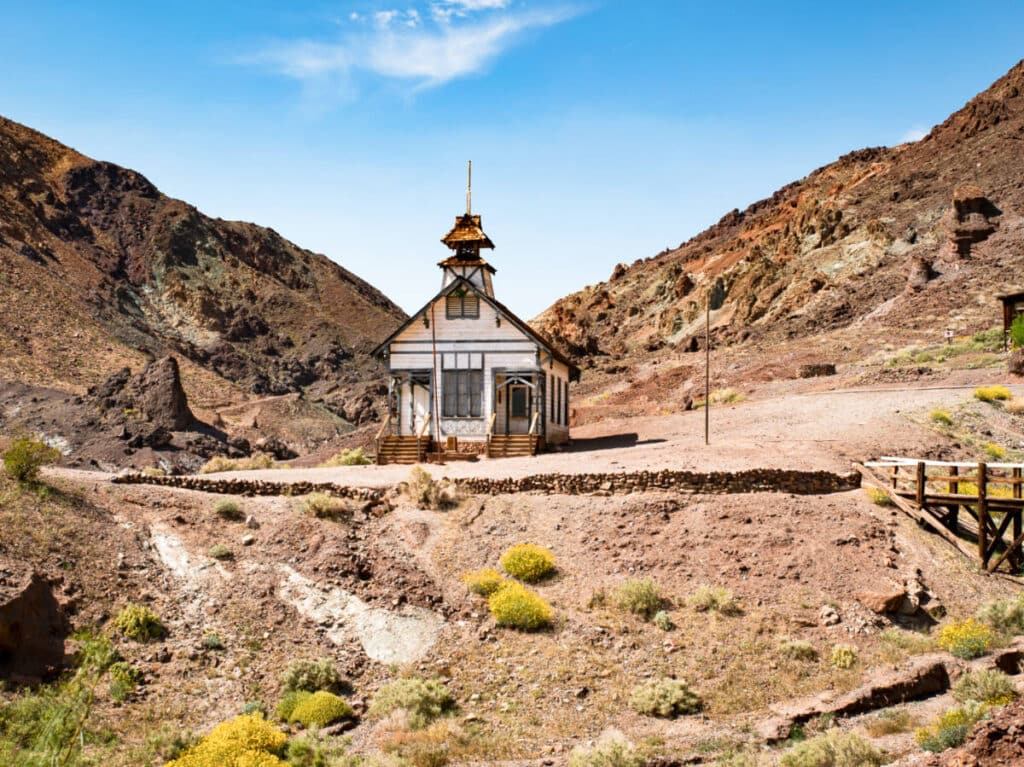 View of an old wooden school house in the middle of the desert