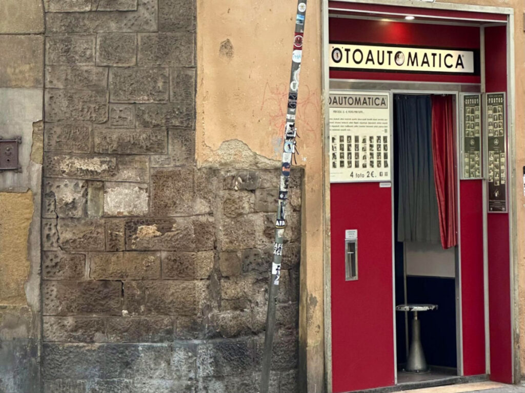 A red old-school photo booth in Florence