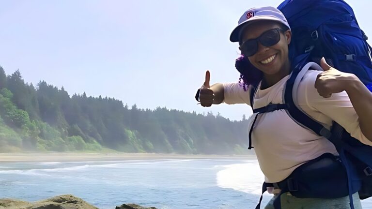 Chelsea Booker smiling for a photo in Olympic National Park