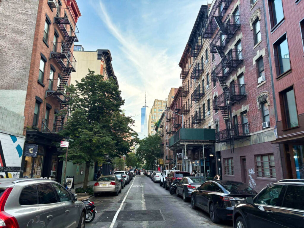 The Freedom Tower at the One World Trade Center seen from the street in SoHo
