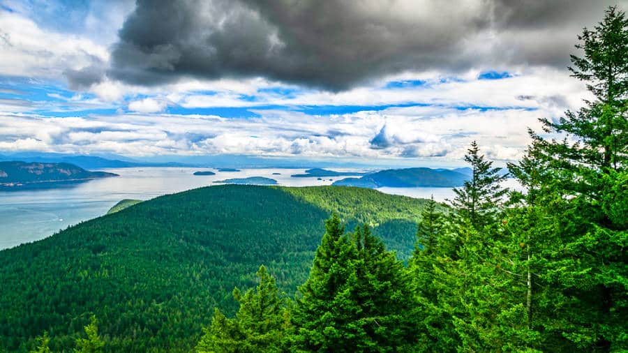 View of the green mountains on Orcas Island on a cloudy day
