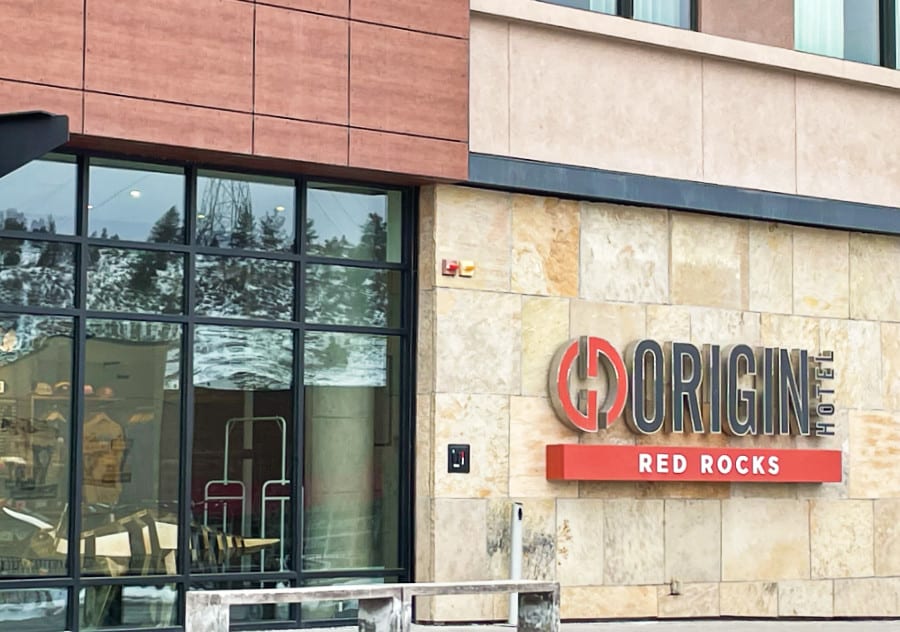 View of the signage of Origin Hotel Red Rocks outside the building