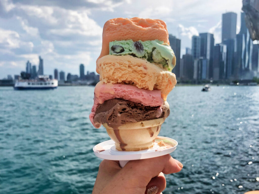 A hand holding an Original Rainbow Cone