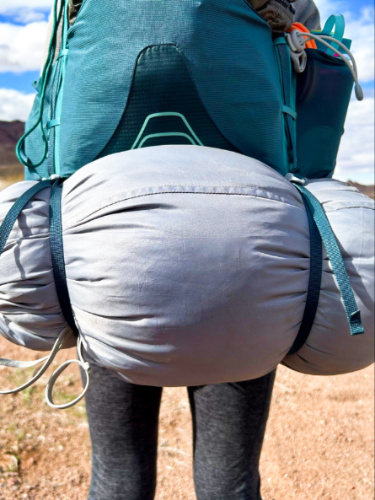 A camping gear strapped on the removable compression straps of Osprey Eja Backpack